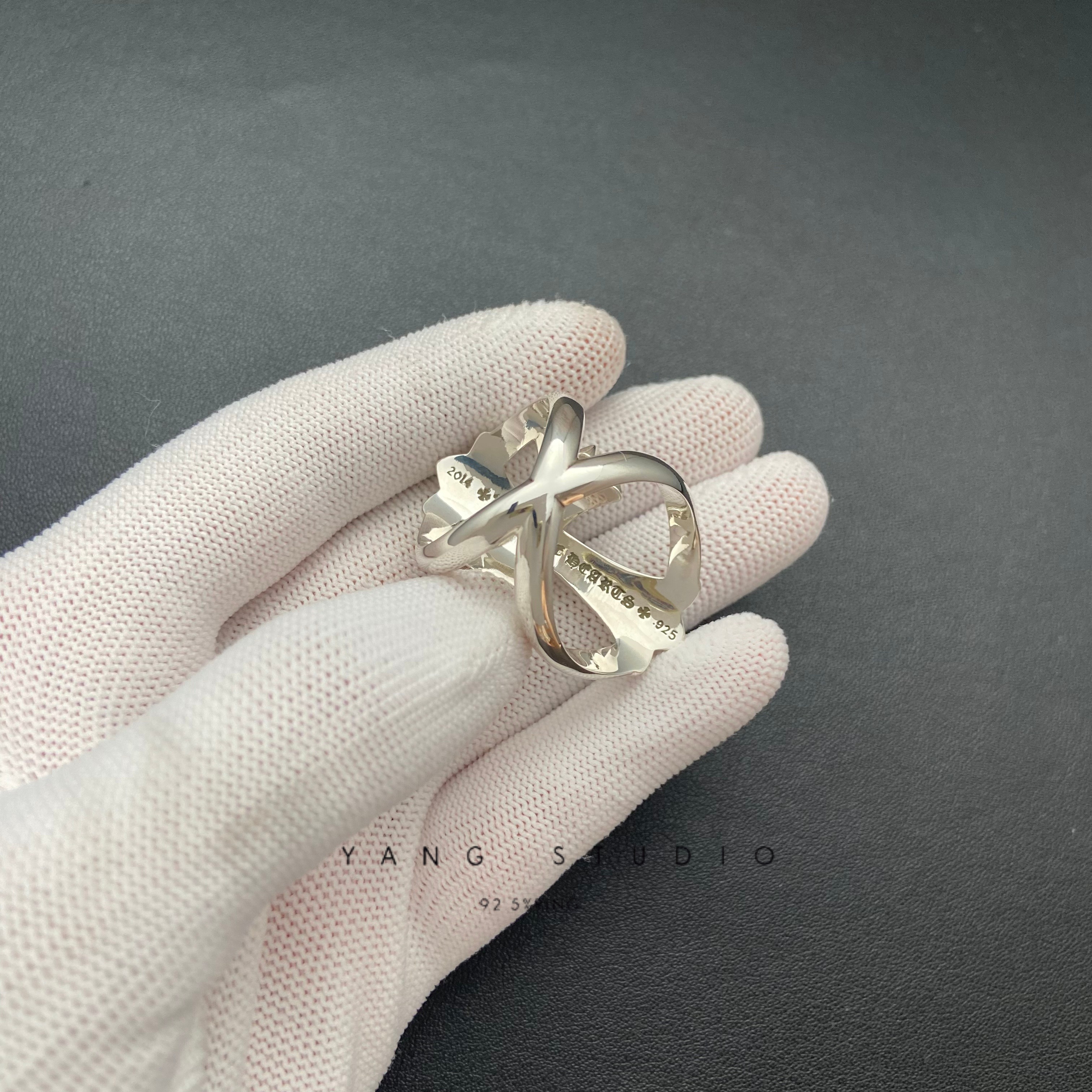 INFINITY CROSS RING WITH PINK SAPPHIRE