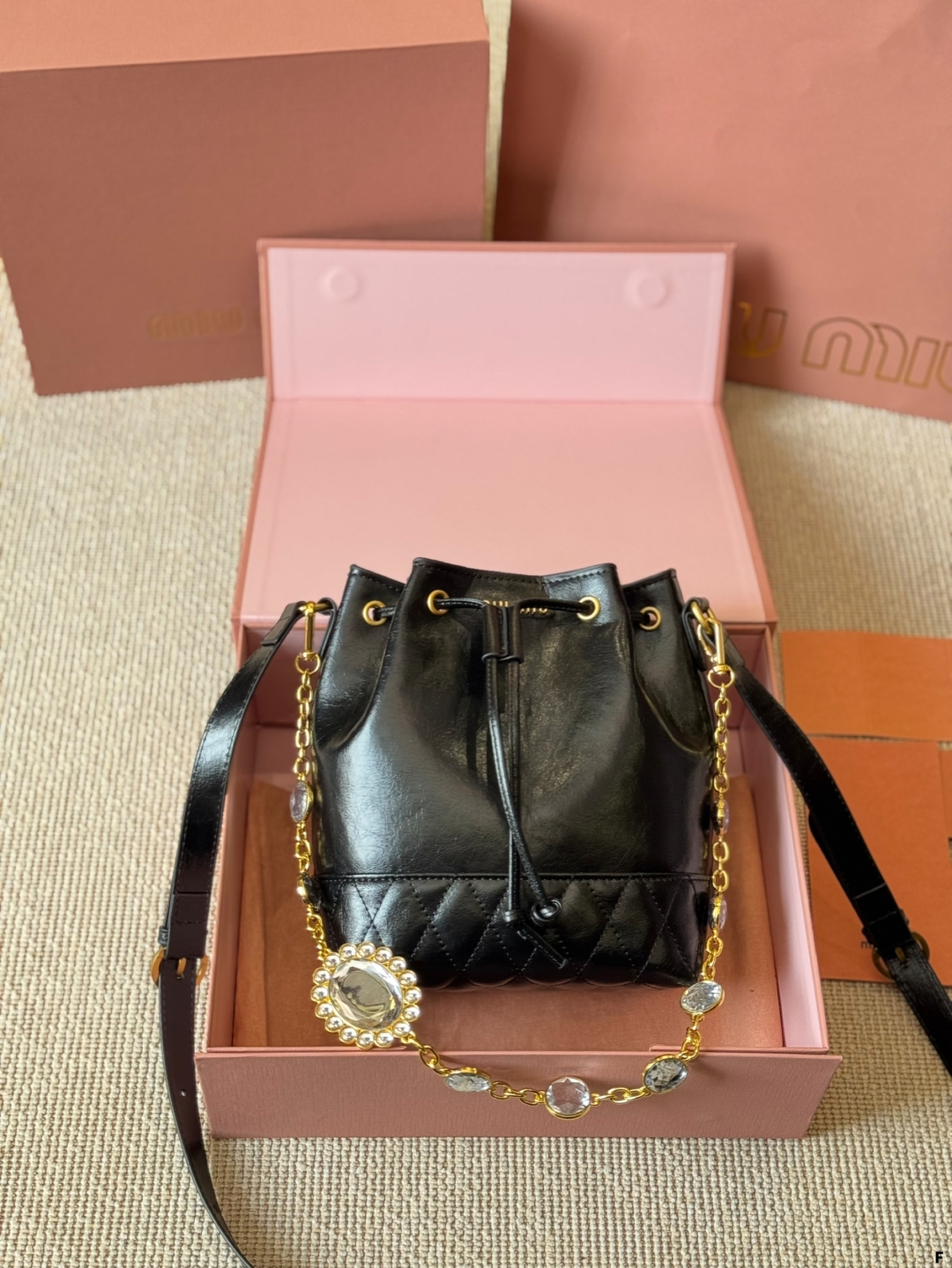 MiuMiu waxed leather small bucket bag