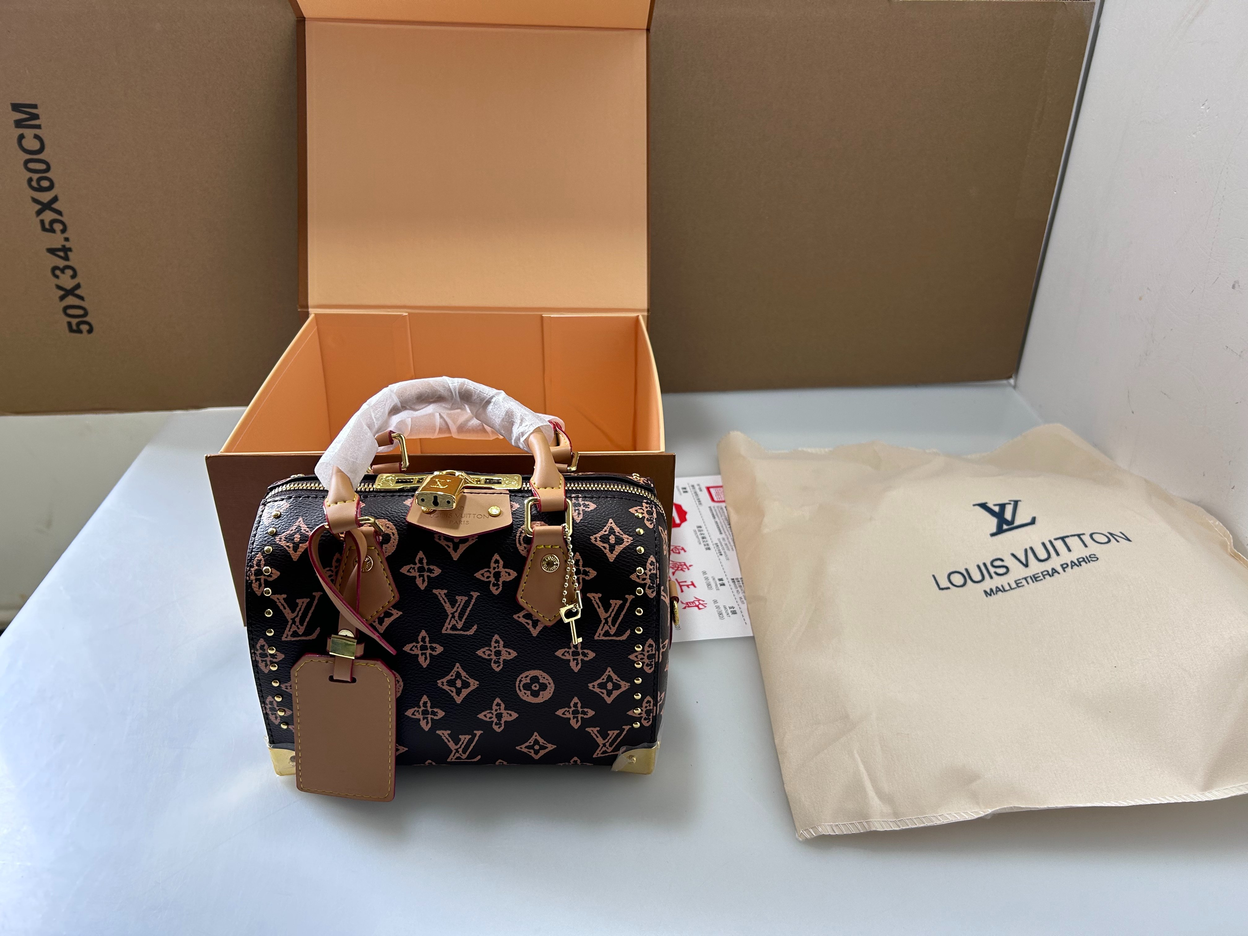 Louis Vuitton studded Speedy Boston pillow bag