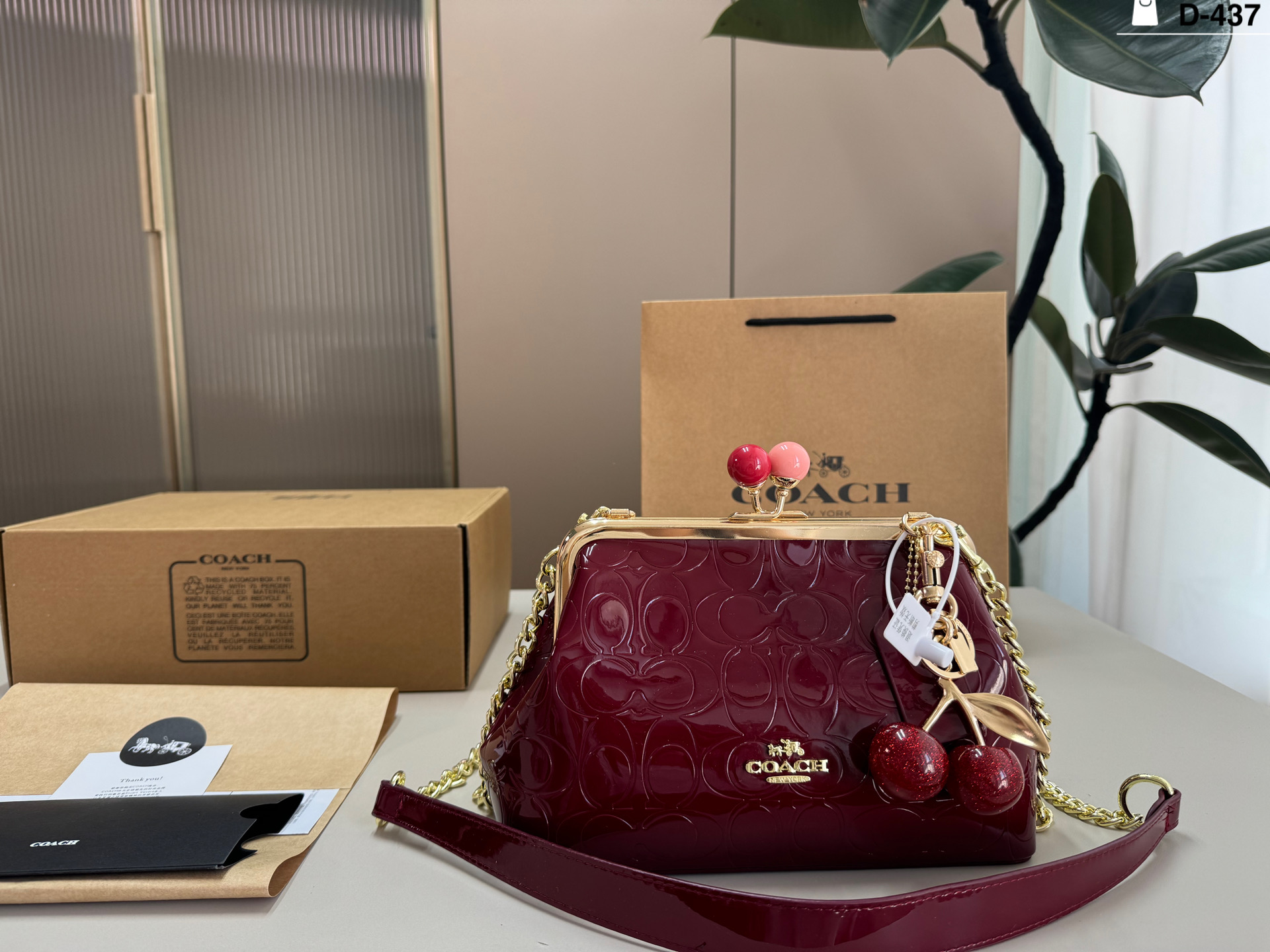 COACH Embossed Clip Bag