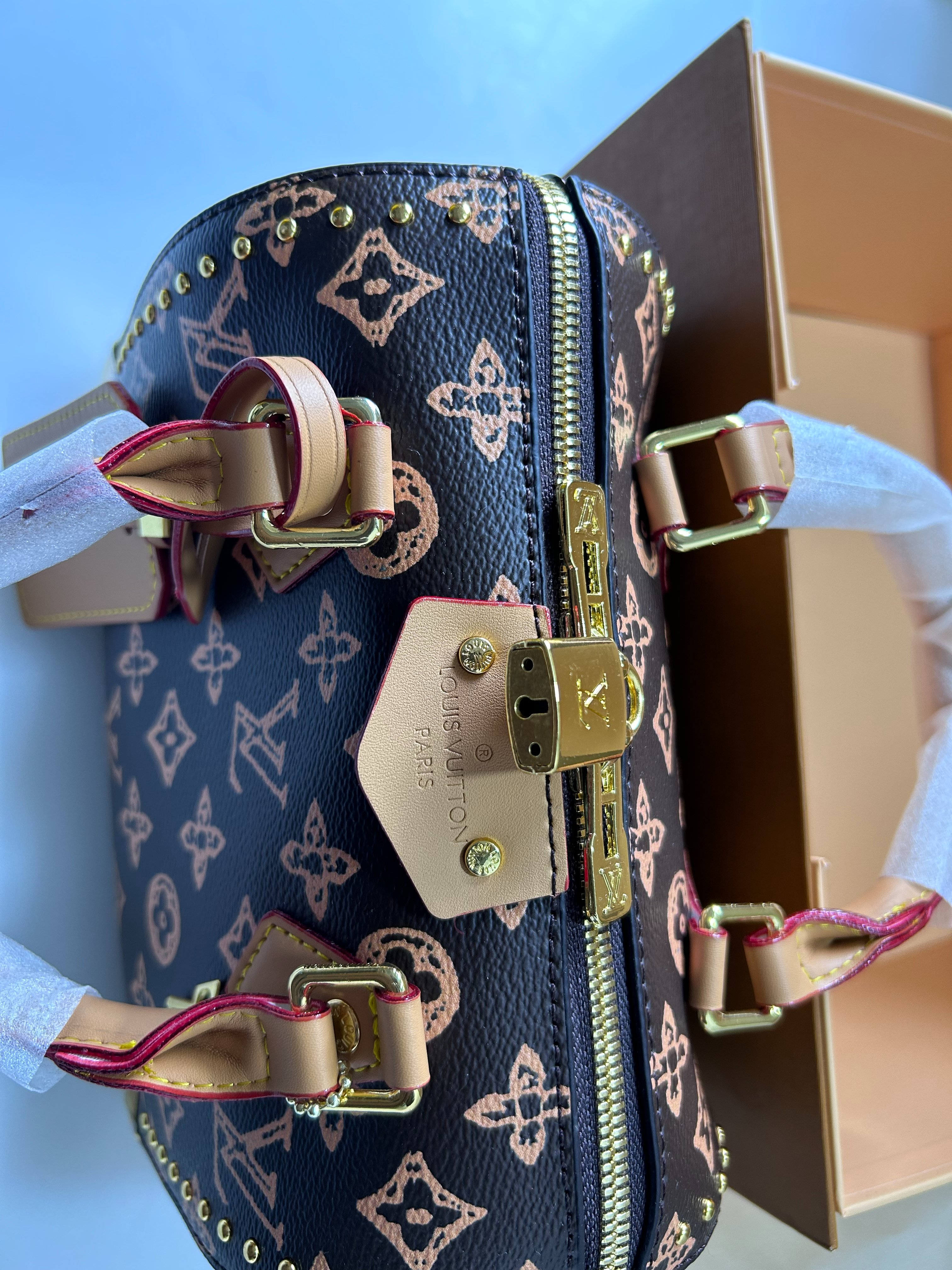 Louis Vuitton studded Speedy Boston pillow bag