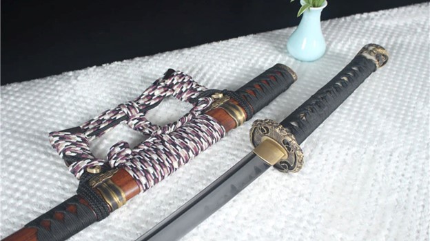 Vee Make katana -Chrysanthemum taidao sword lying on table