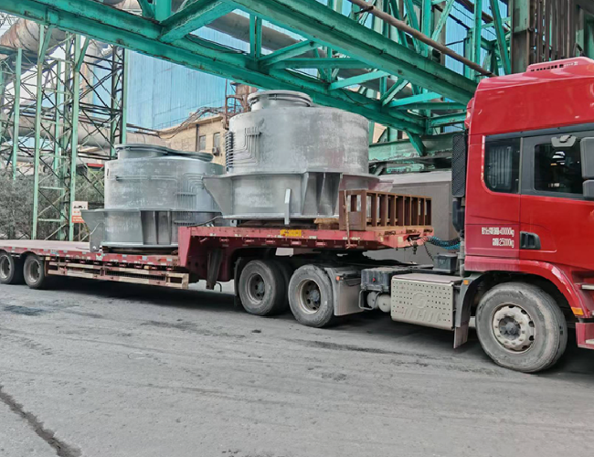 What material is used for the sealing surface of the coke oven flue damper valve?