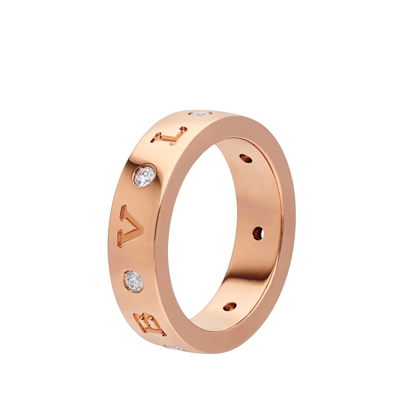 18 KT BAND RING, SET WITH SEVEN DIAMONDS