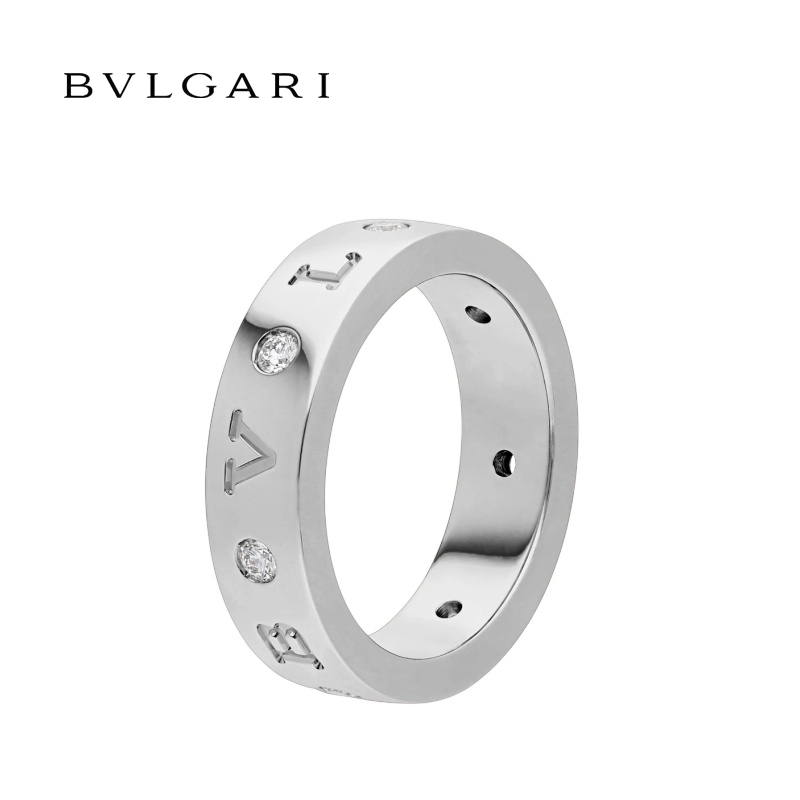 18 KT BAND RING, SET WITH SEVEN DIAMONDS