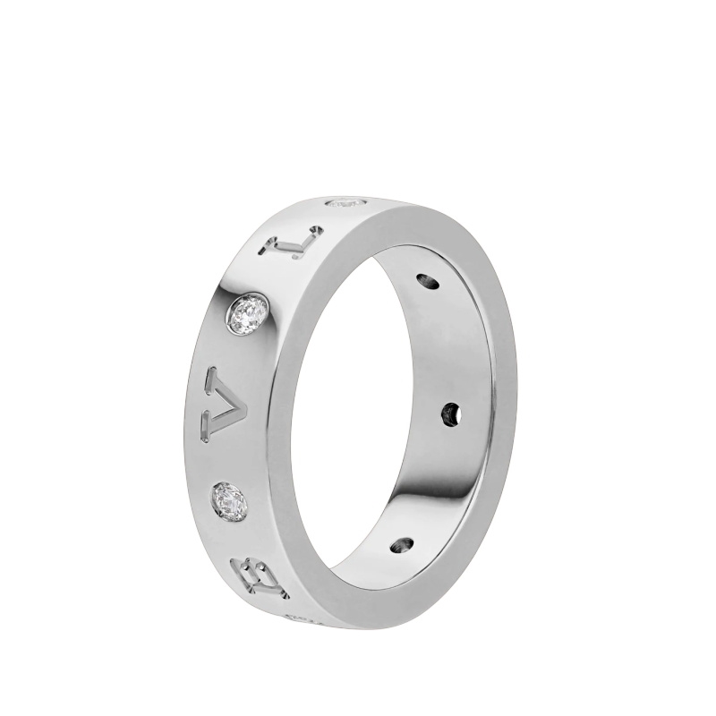 18 KT BAND RING, SET WITH SEVEN DIAMONDS