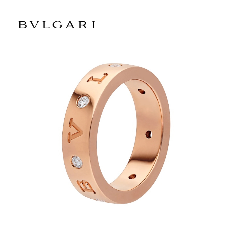 18 KT BAND RING, SET WITH SEVEN DIAMONDS