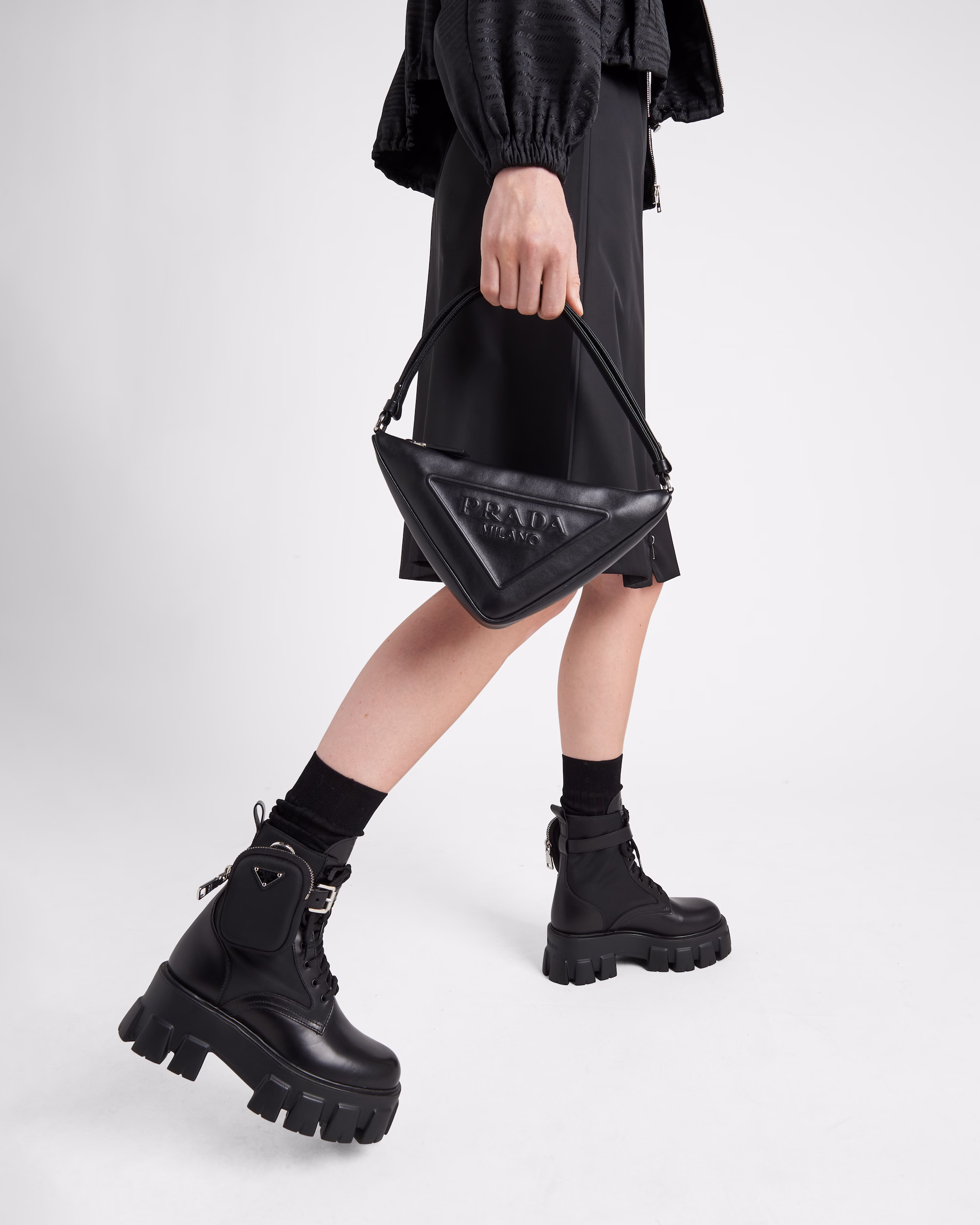 Prada Monolith glossed-leather and nylon mid-calf boots