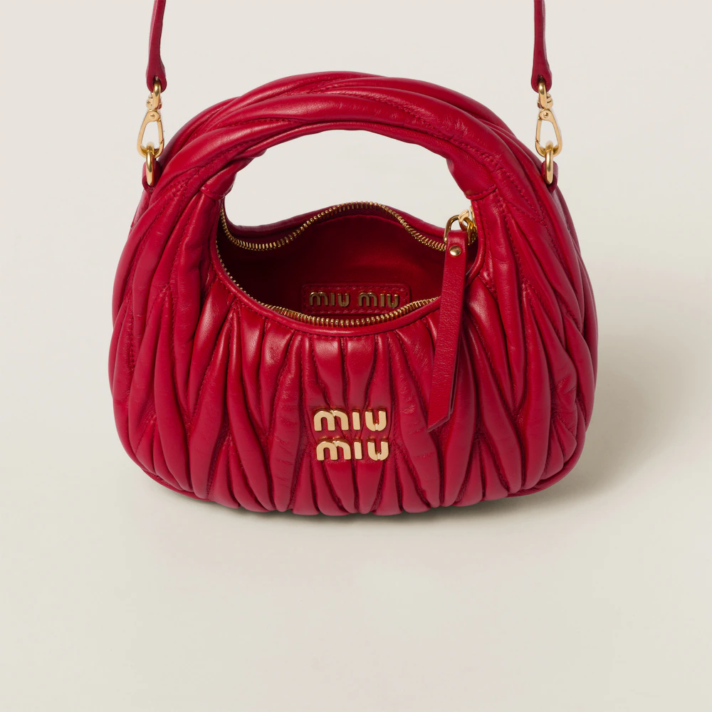 Miu Miu bags: Wander Matelassé mini Hobo bag in soft lambskin leather, small crescent bag.