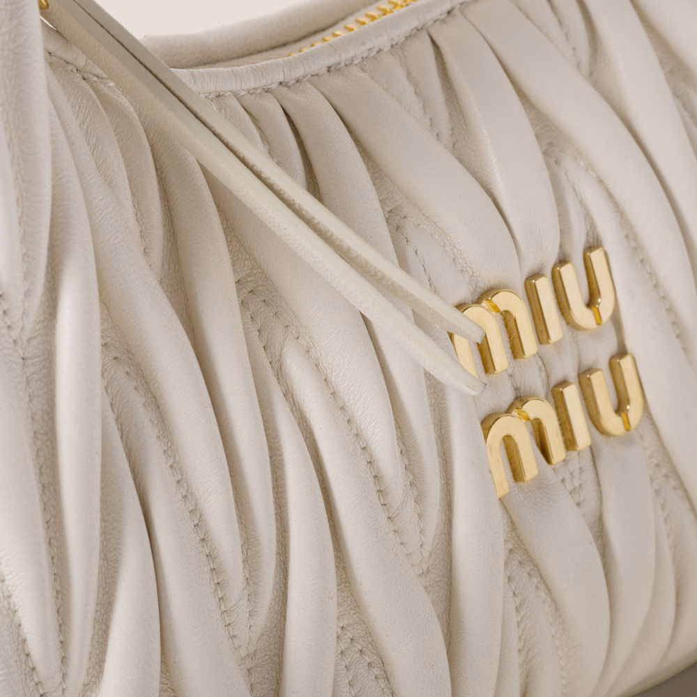 Miu Miu bags: Wander Matelassé mini Hobo bag in soft lambskin leather, small crescent bag.