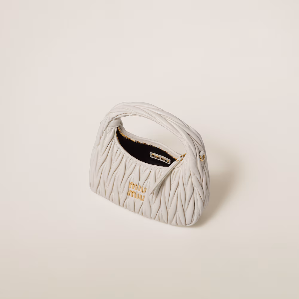 Miu Miu bags: Wander Matelassé mini Hobo bag in soft lambskin leather, small crescent bag.