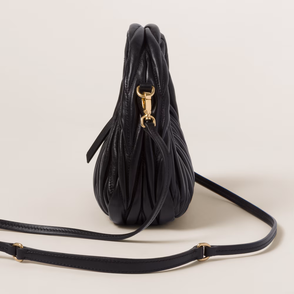 Miu Miu bags: Wander Matelassé mini Hobo bag in soft lambskin leather, small crescent bag.