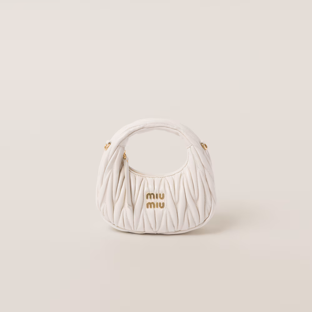 Miu Miu bags: Wander Matelassé mini Hobo bag in soft lambskin leather, small crescent bag.