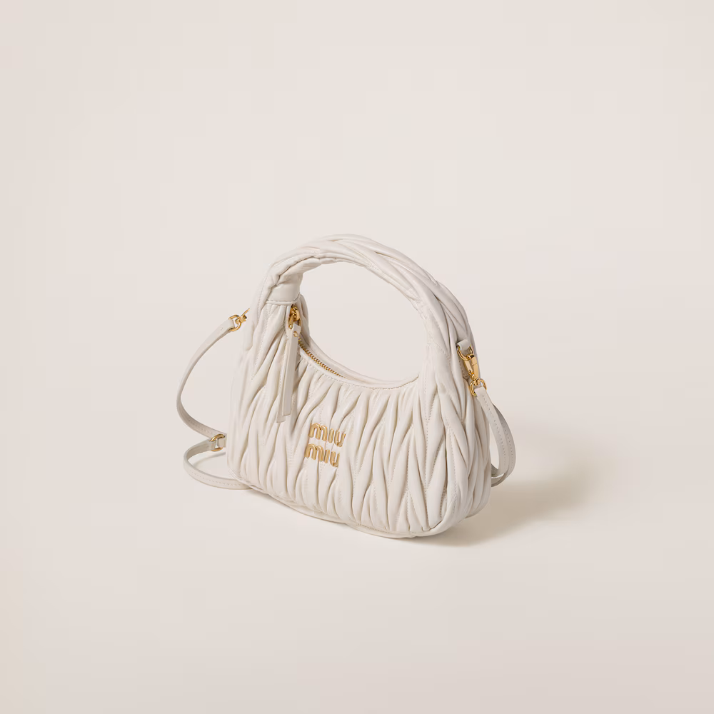 Miu Miu bags: Wander Matelassé mini Hobo bag in soft lambskin leather, small crescent bag.