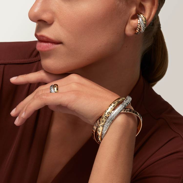 Cartier Trinity single earring, lacquer finish, half-paved with diamonds.