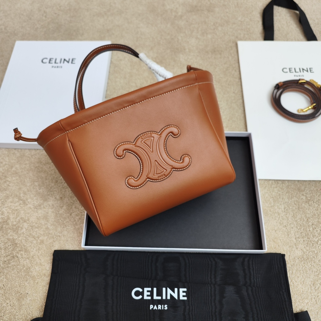 Shop CELINE small drawstring cabas marin in TEXTILE AND CALFSKIN