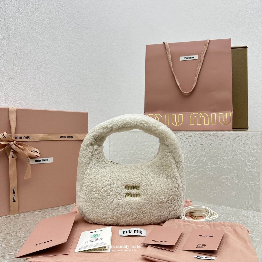 Wander leather detail shearling crescent bag