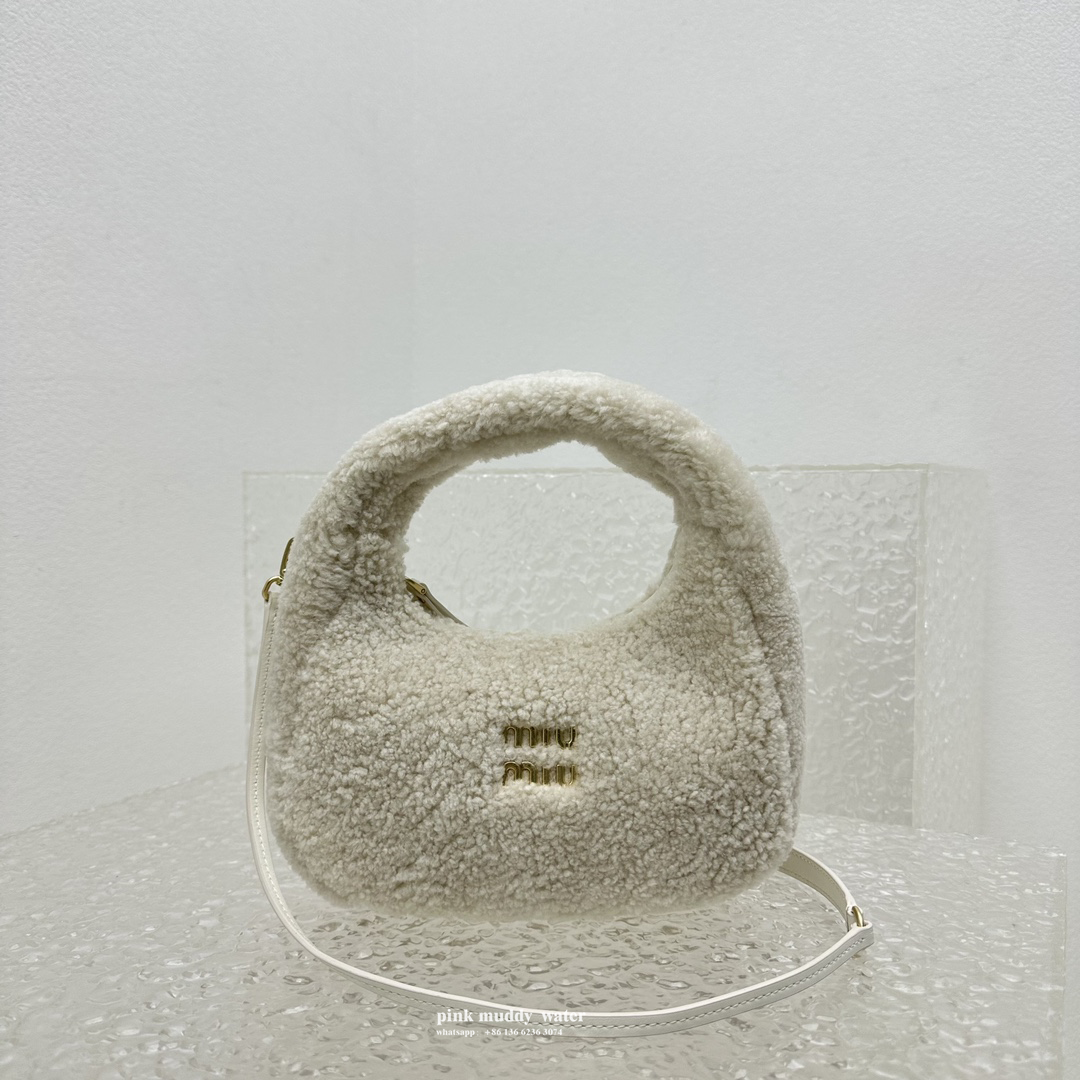 Wander leather detail shearling crescent bag