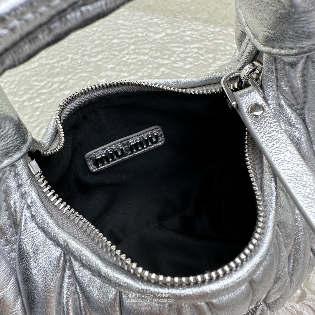 Wander leather detail shearling crescent bag