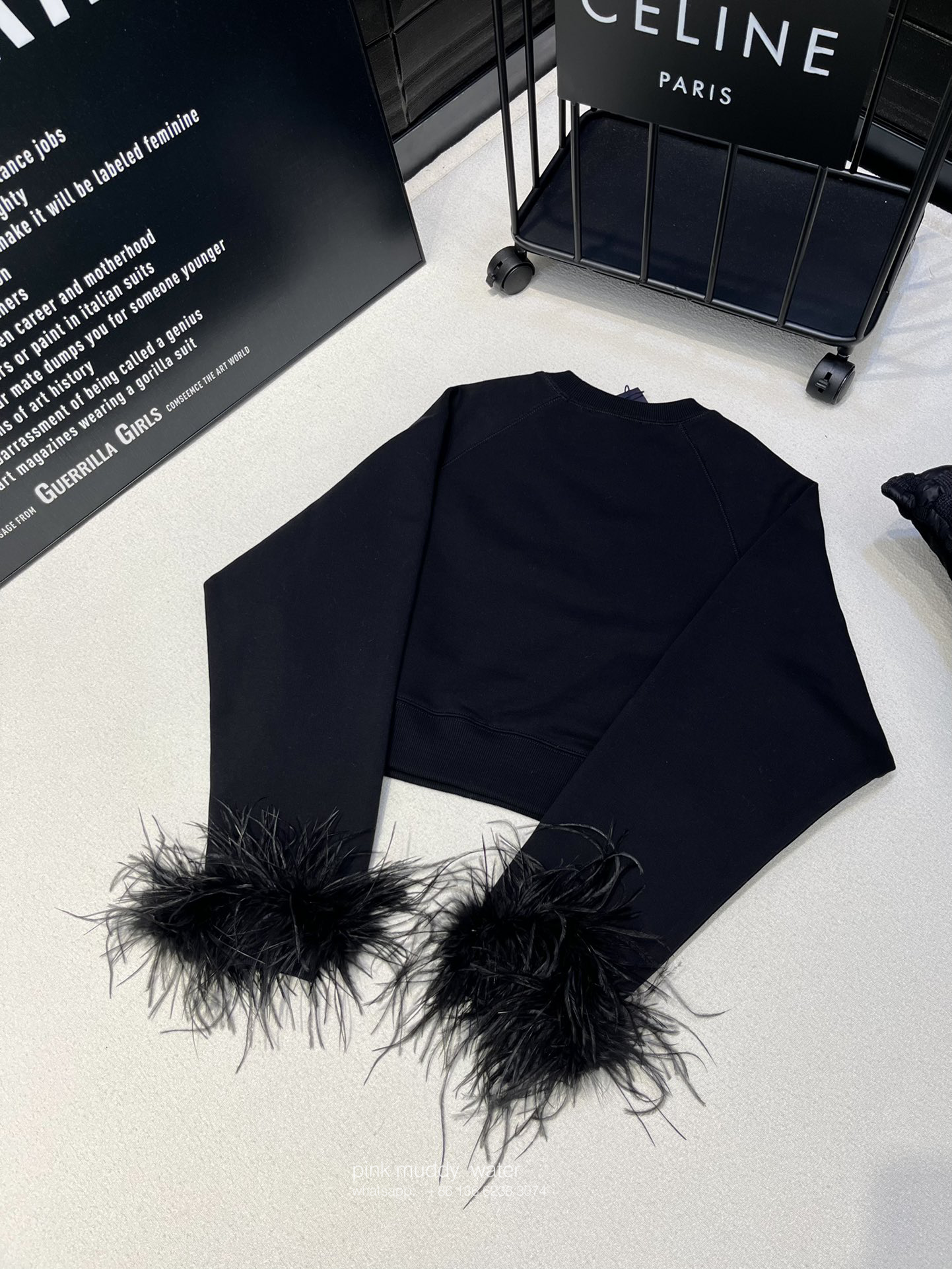 Crew-neck sweatshirt with feather trim