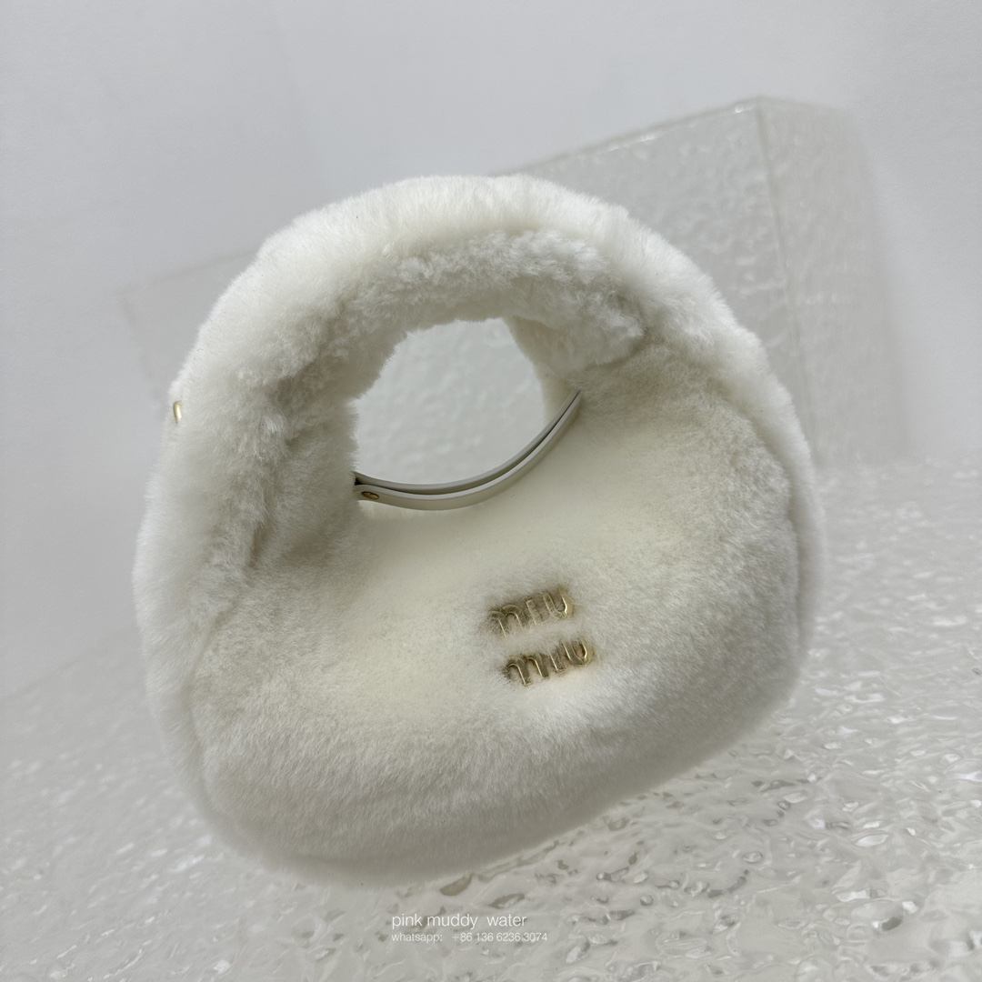 Wander leather detail shearling crescent bag