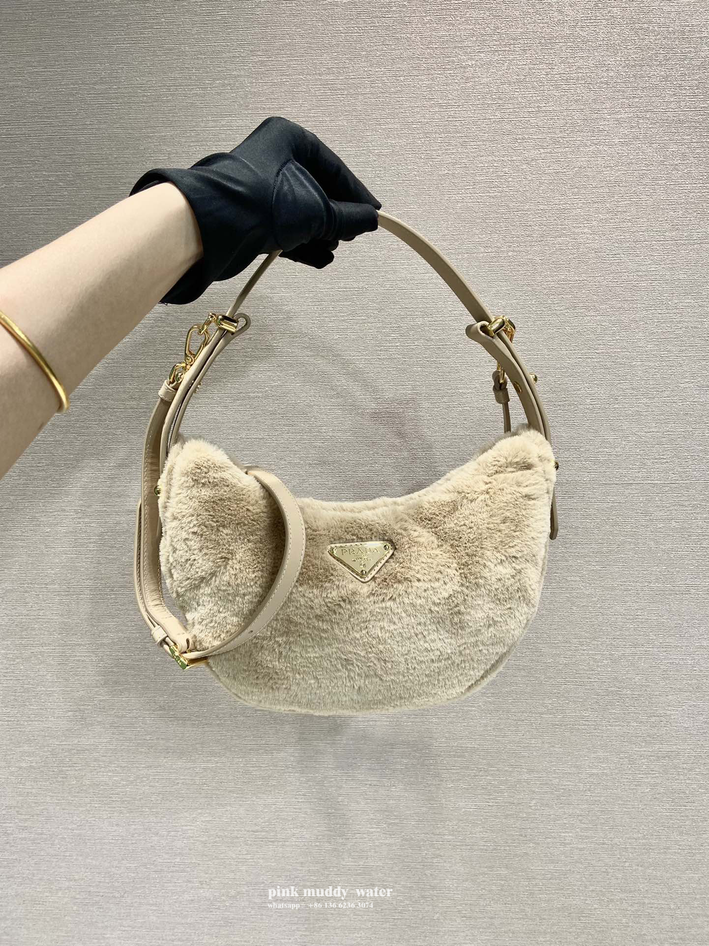 Prada Arqué shearling and leather shoulder bag
