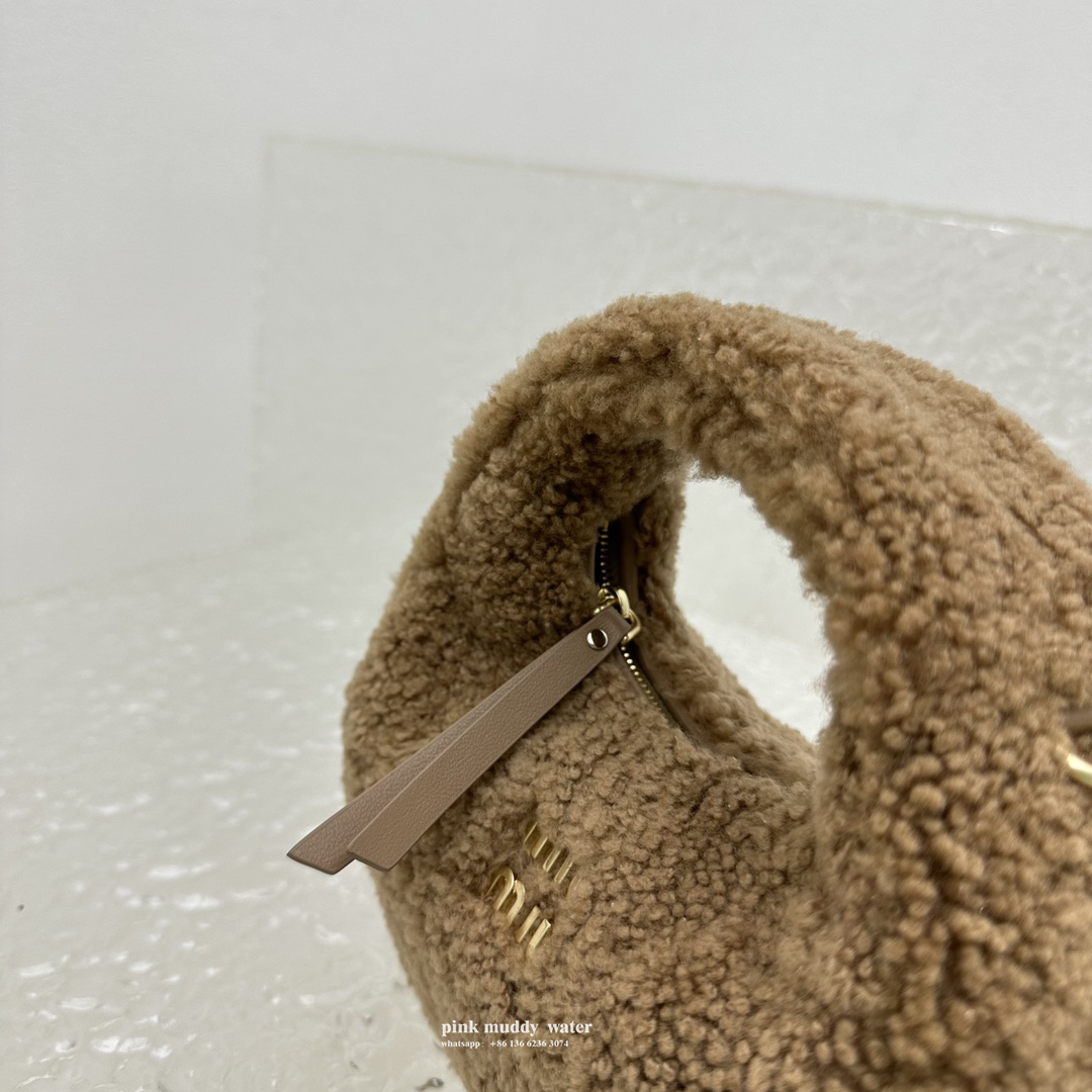 Wander leather detail shearling crescent bag