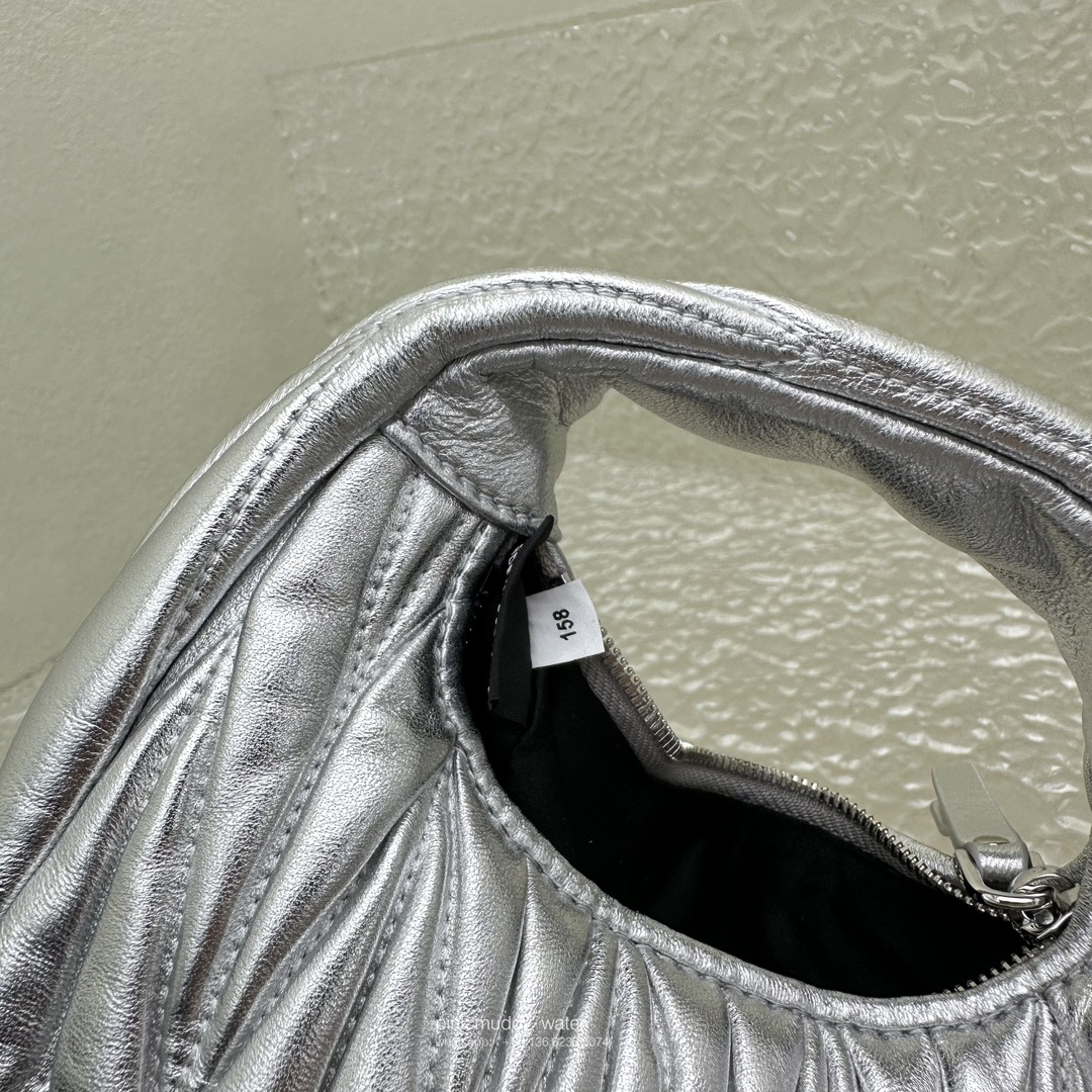 Wander leather detail shearling crescent bag