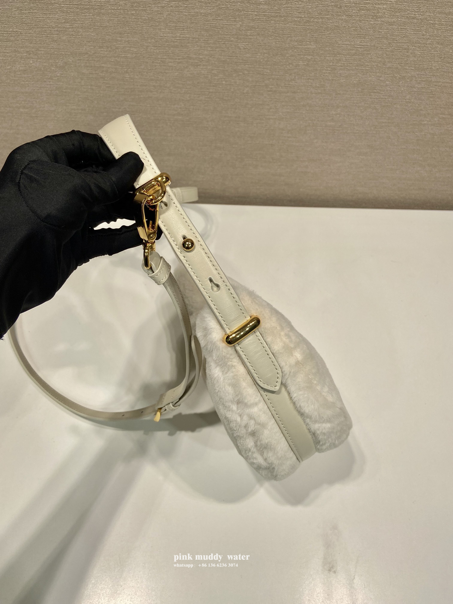 Prada Arqué shearling and leather shoulder bag