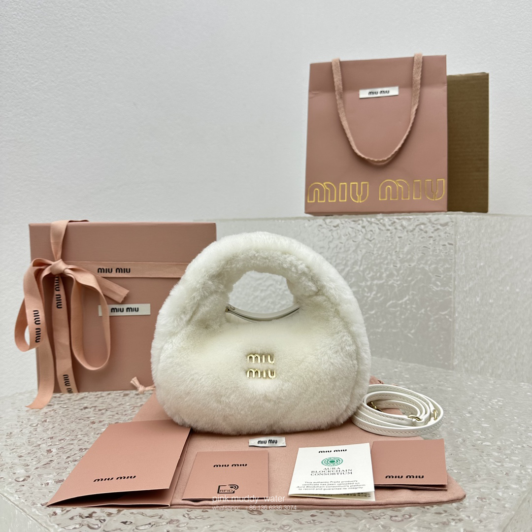 Wander leather detail shearling crescent bag