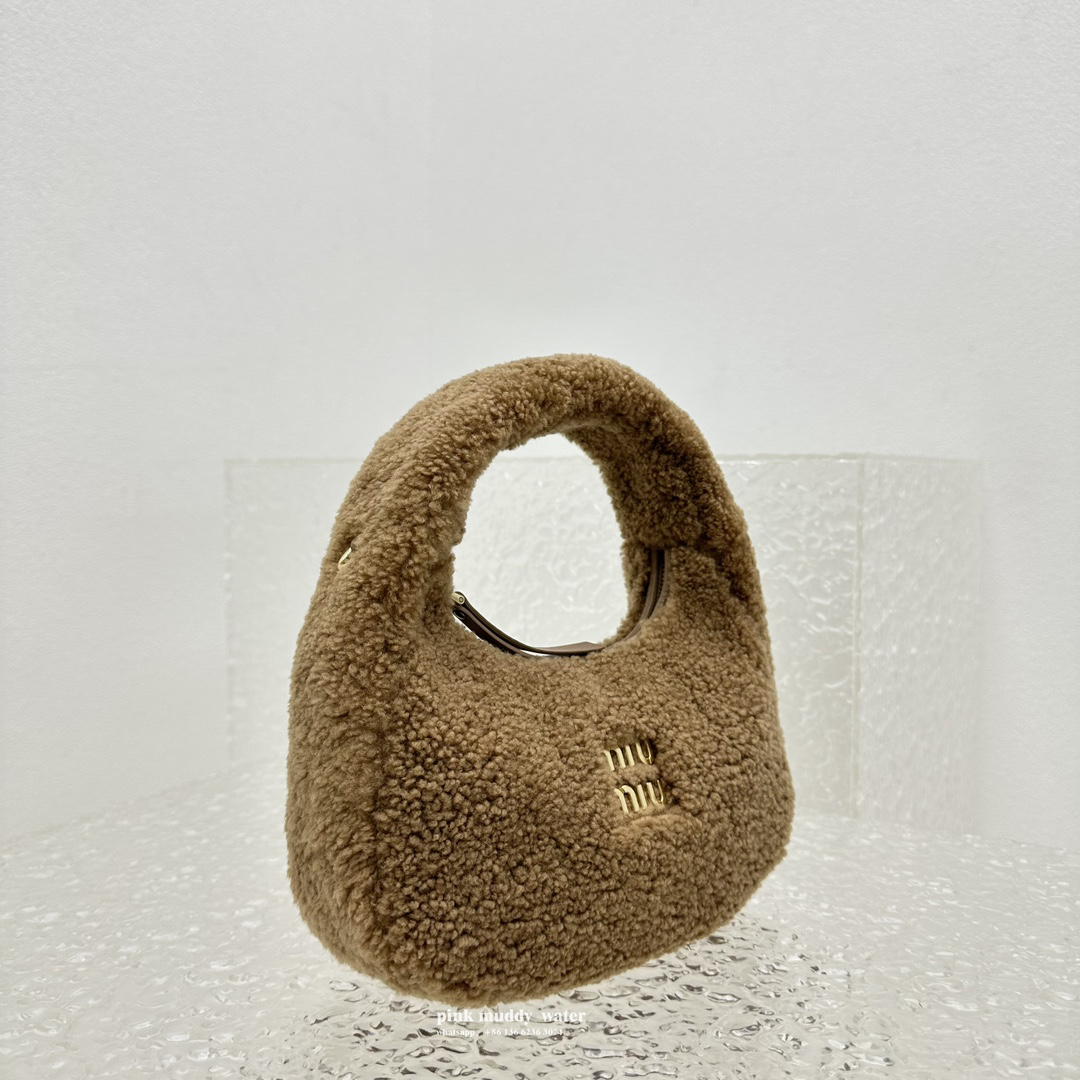 Wander leather detail shearling crescent bag