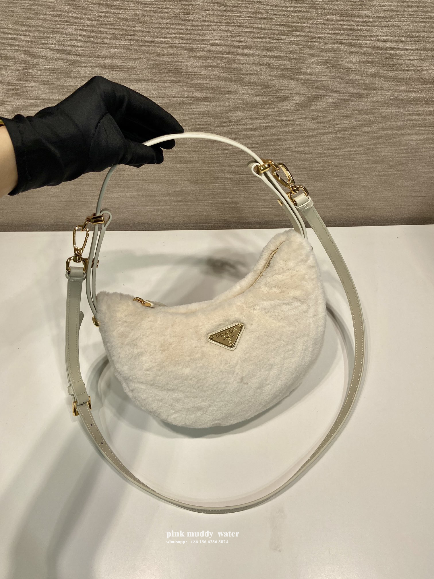 Prada Arqué shearling and leather shoulder bag