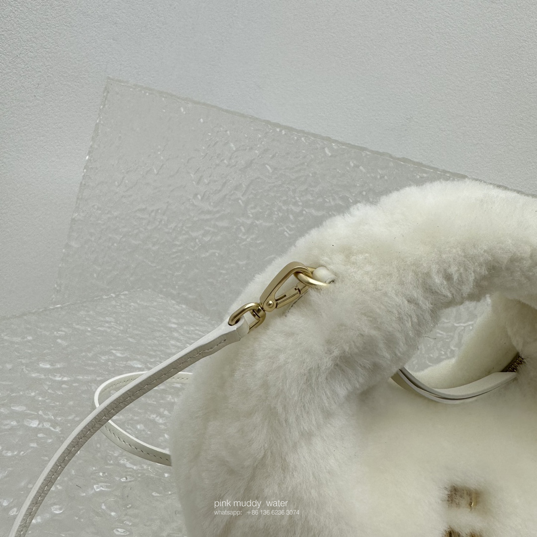 Wander leather detail shearling crescent bag