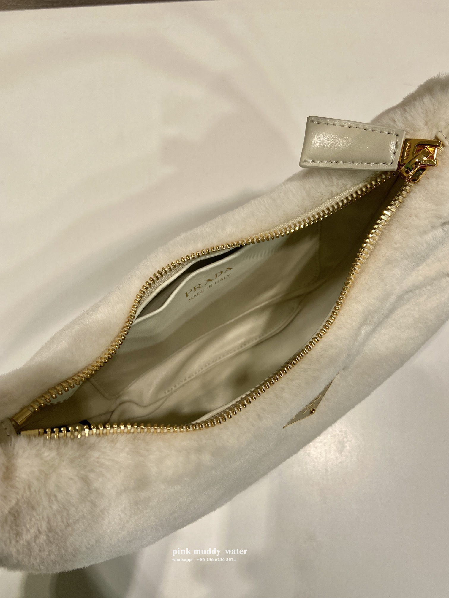 Prada Arqué shearling and leather shoulder bag