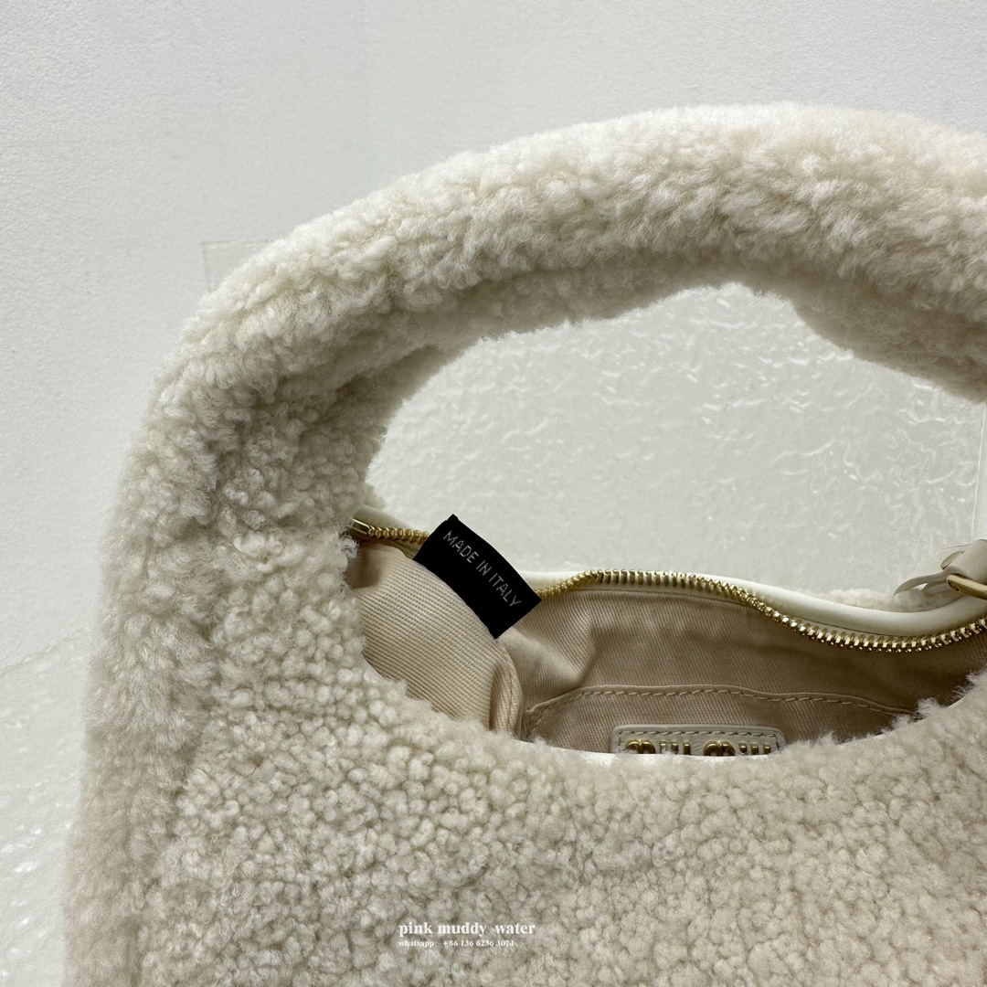 Wander leather detail shearling crescent bag