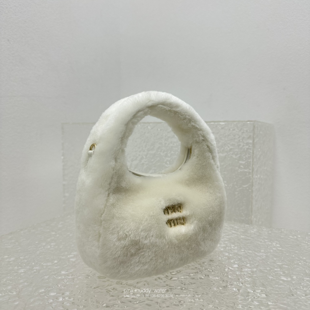 Wander leather detail shearling crescent bag