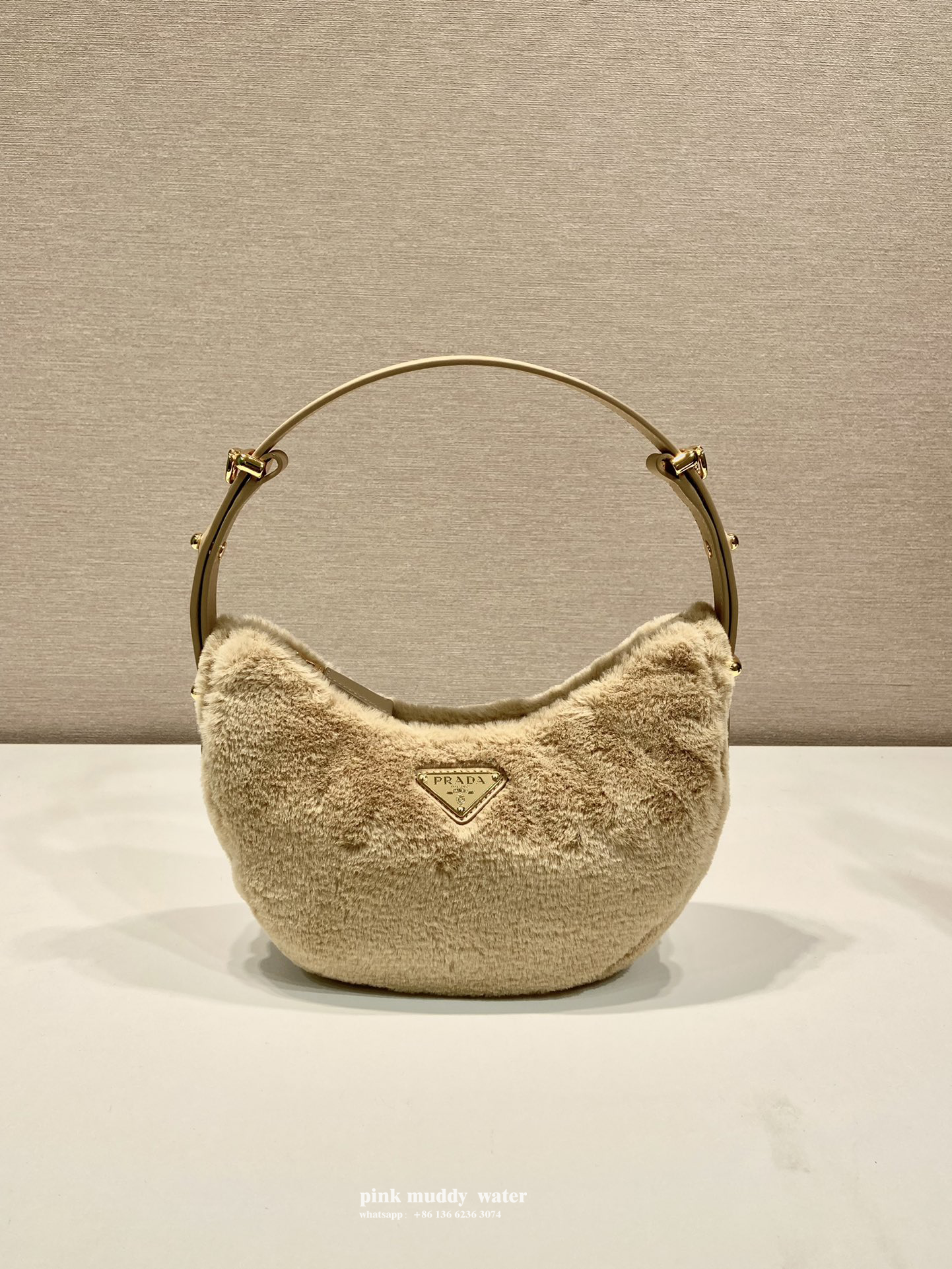 Prada Arqué shearling and leather shoulder bag