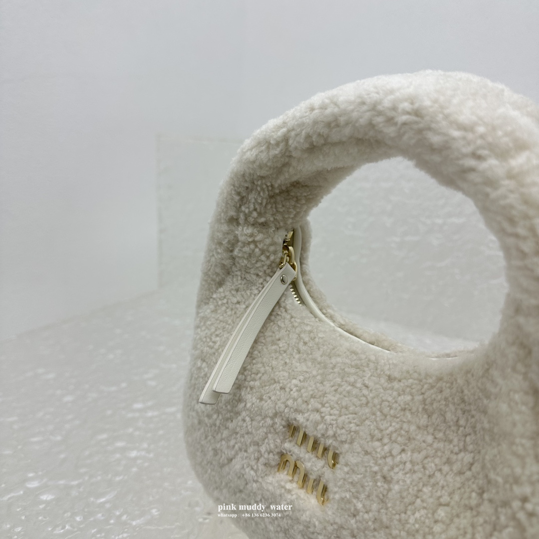 Wander leather detail shearling crescent bag