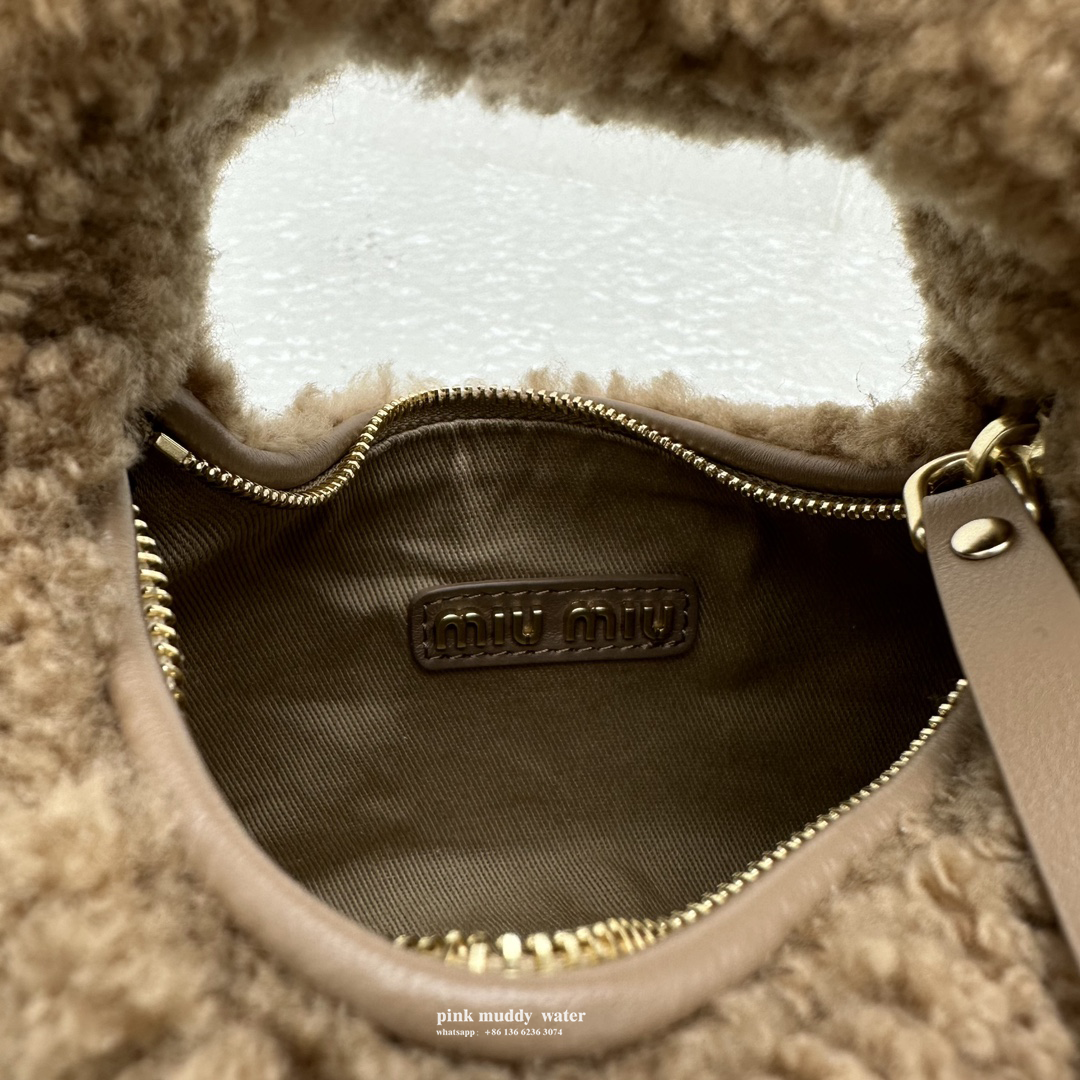 Wander leather detail shearling crescent bag