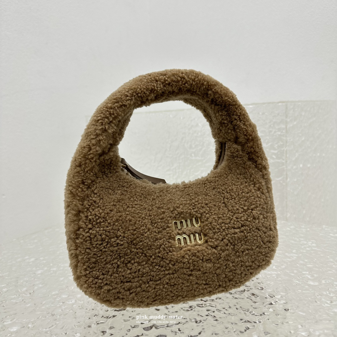Wander leather detail shearling crescent bag