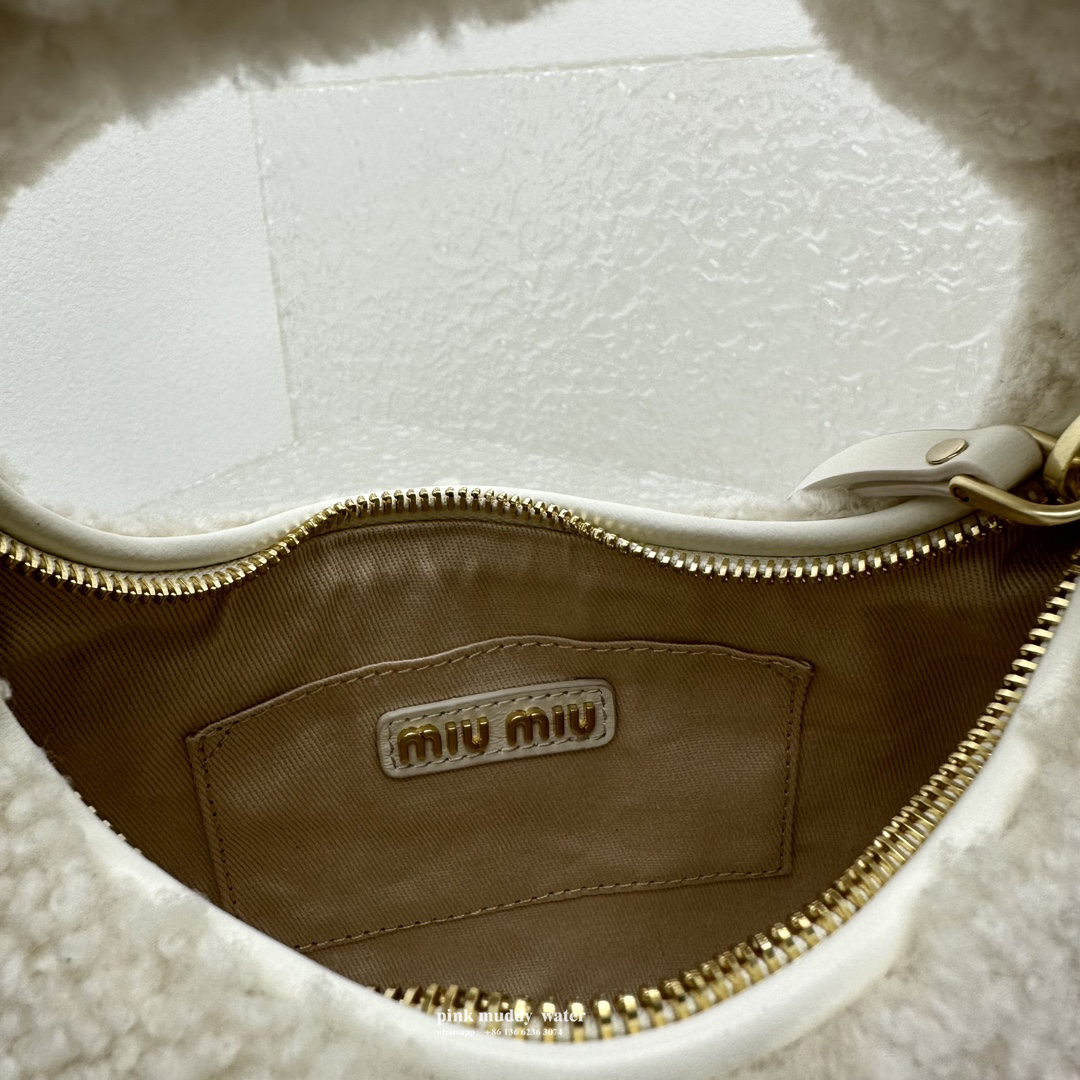 Wander leather detail shearling crescent bag