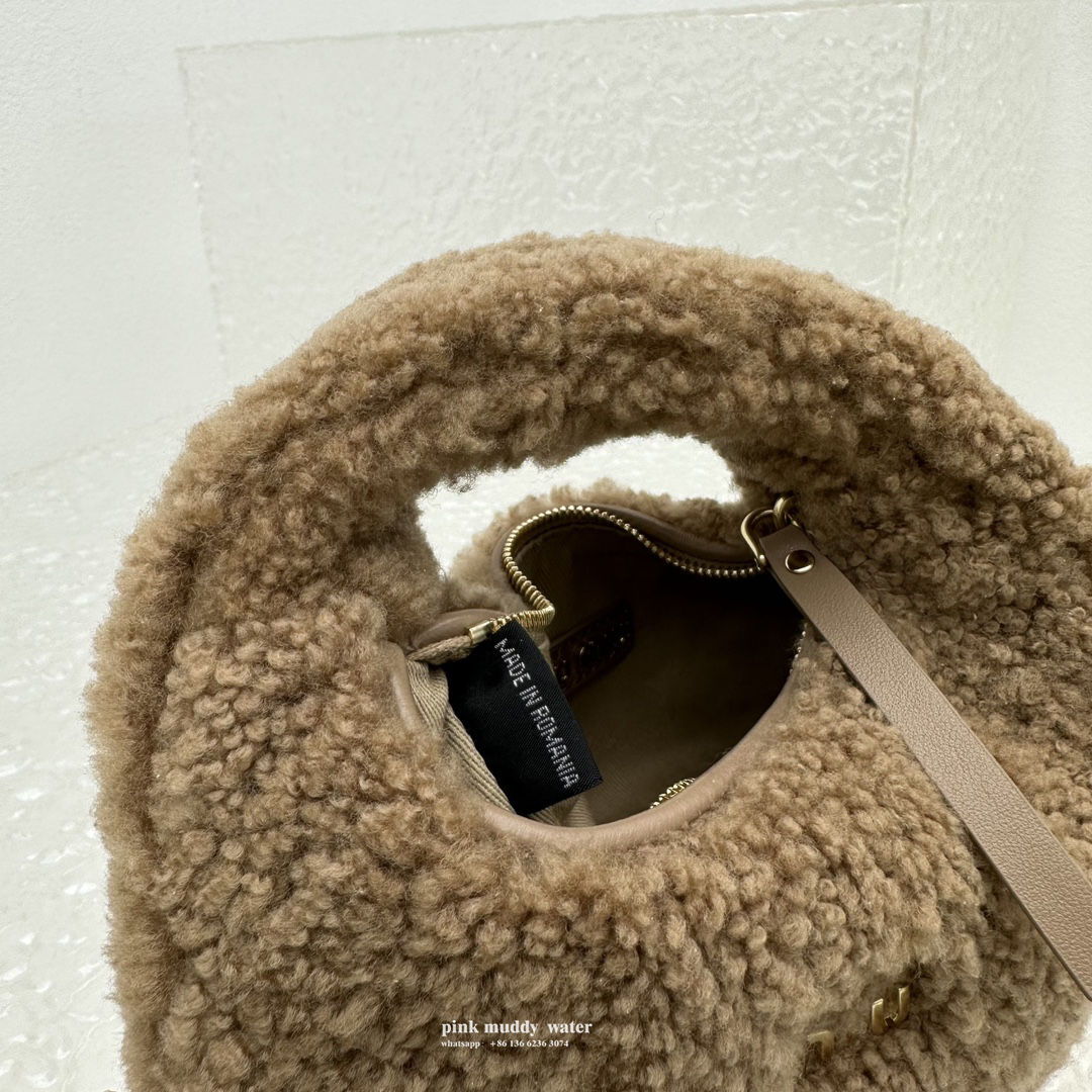 Wander leather detail shearling crescent bag