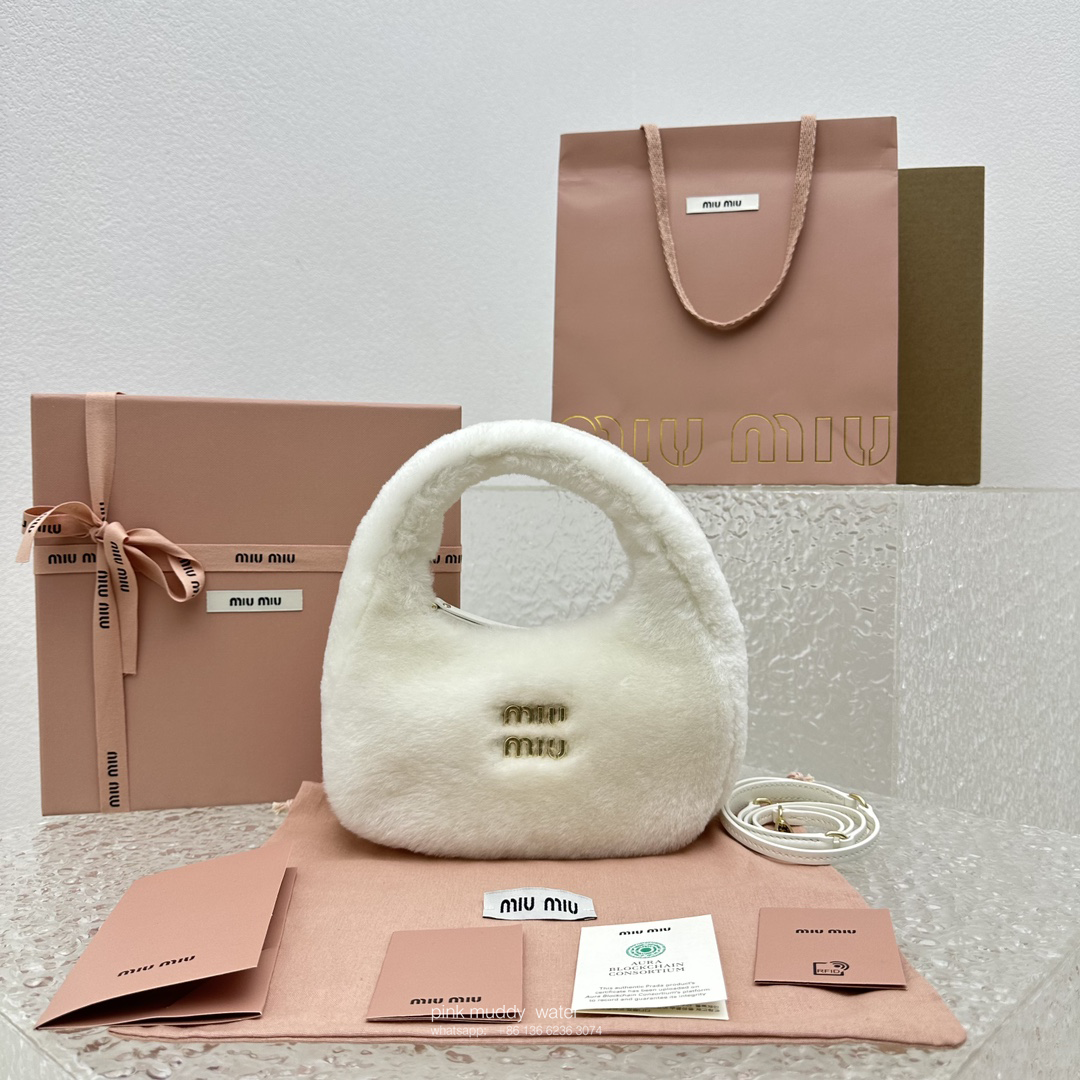 Wander leather detail shearling crescent bag