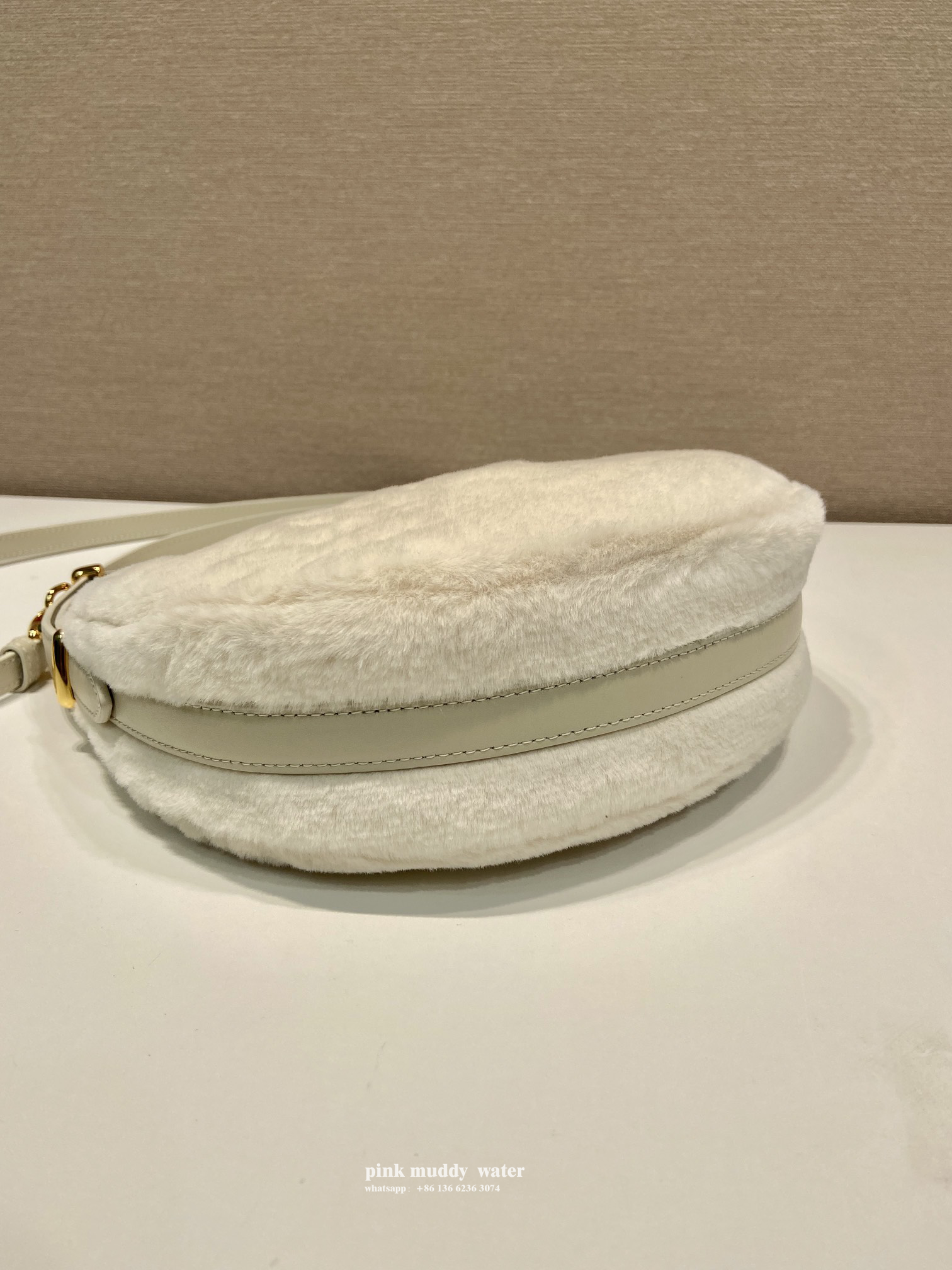 Prada Arqué shearling and leather shoulder bag