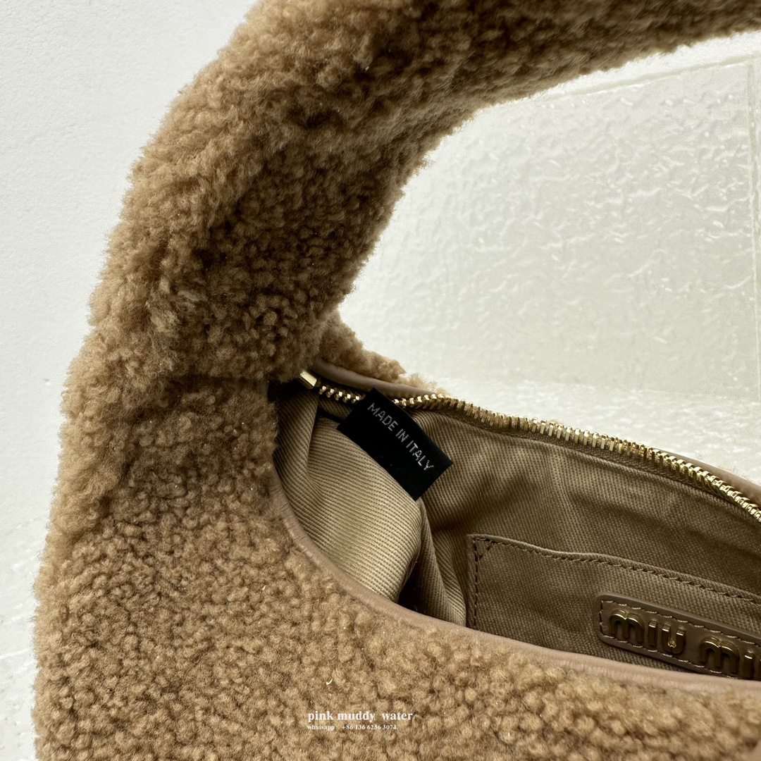 Wander leather detail shearling crescent bag