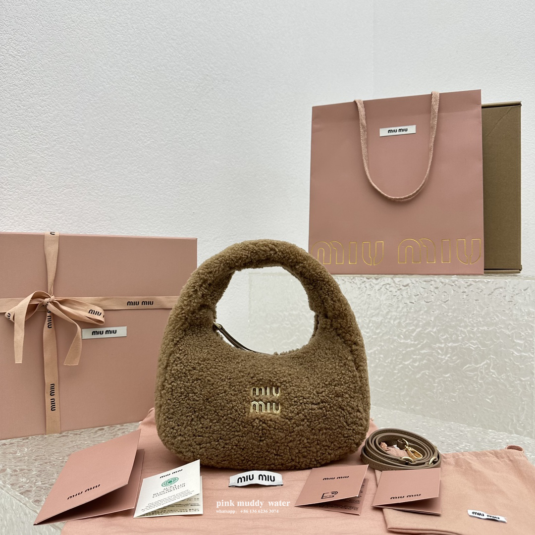 Wander leather detail shearling crescent bag