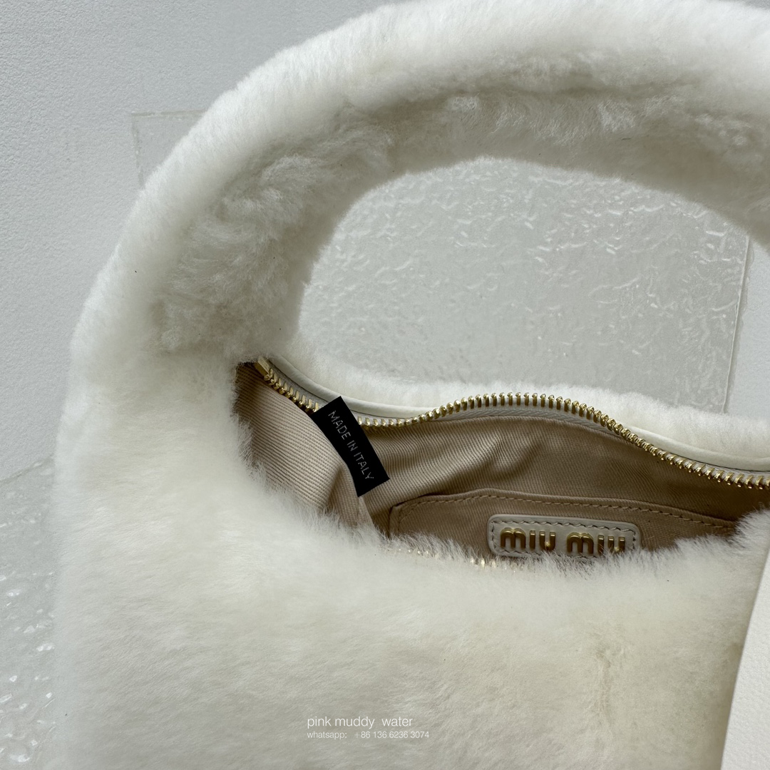 Wander leather detail shearling crescent bag