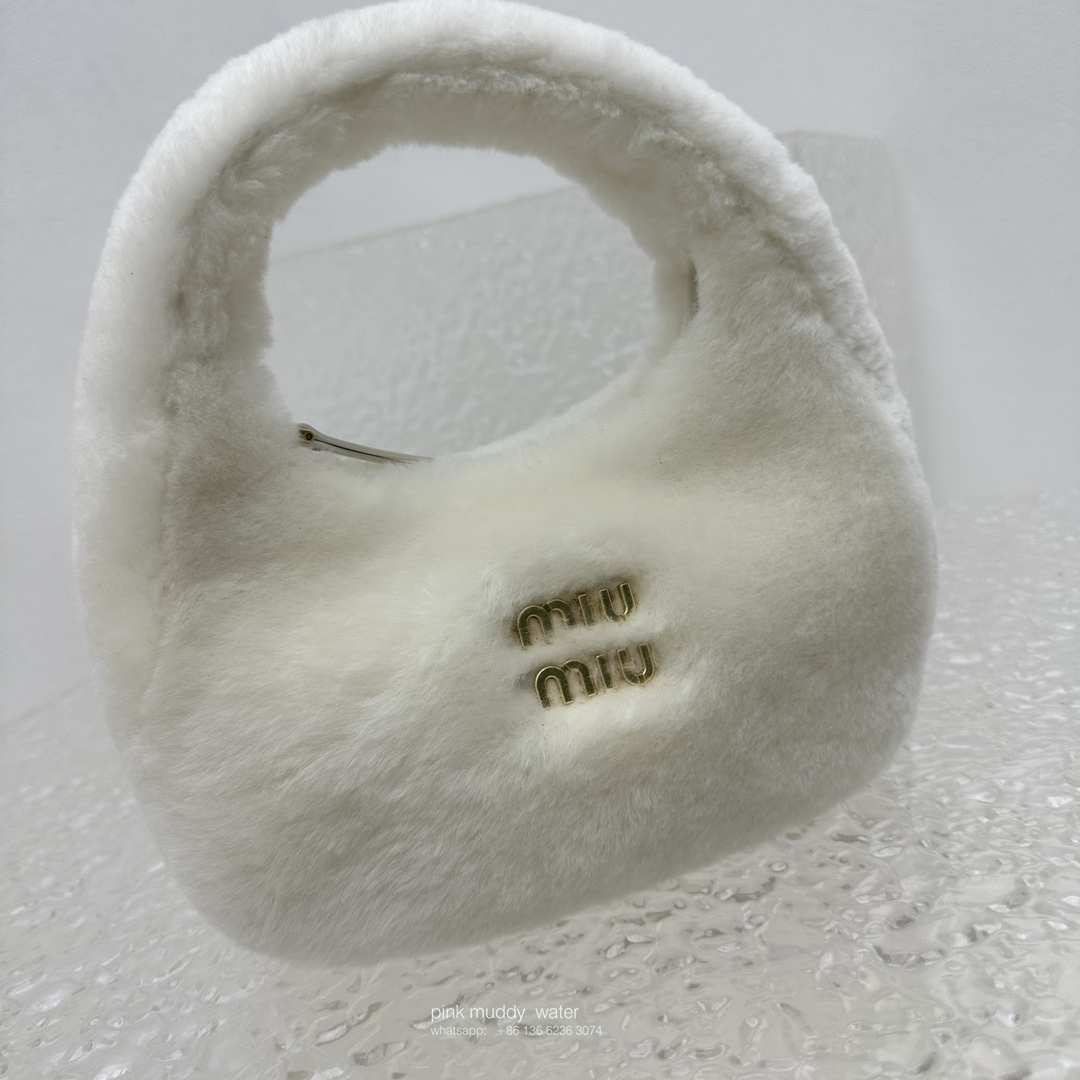 Wander leather detail shearling crescent bag