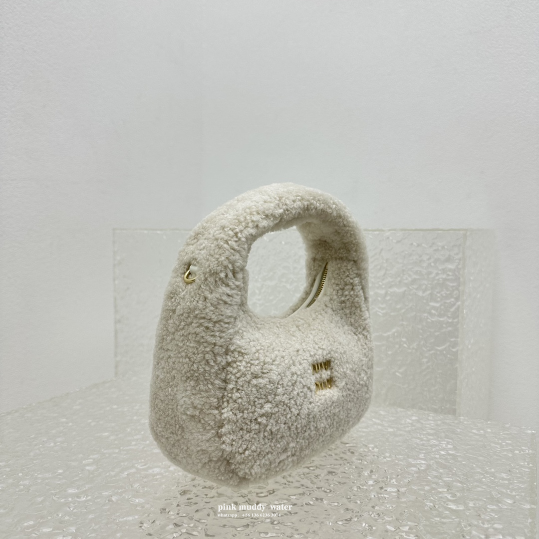 Wander leather detail shearling crescent bag