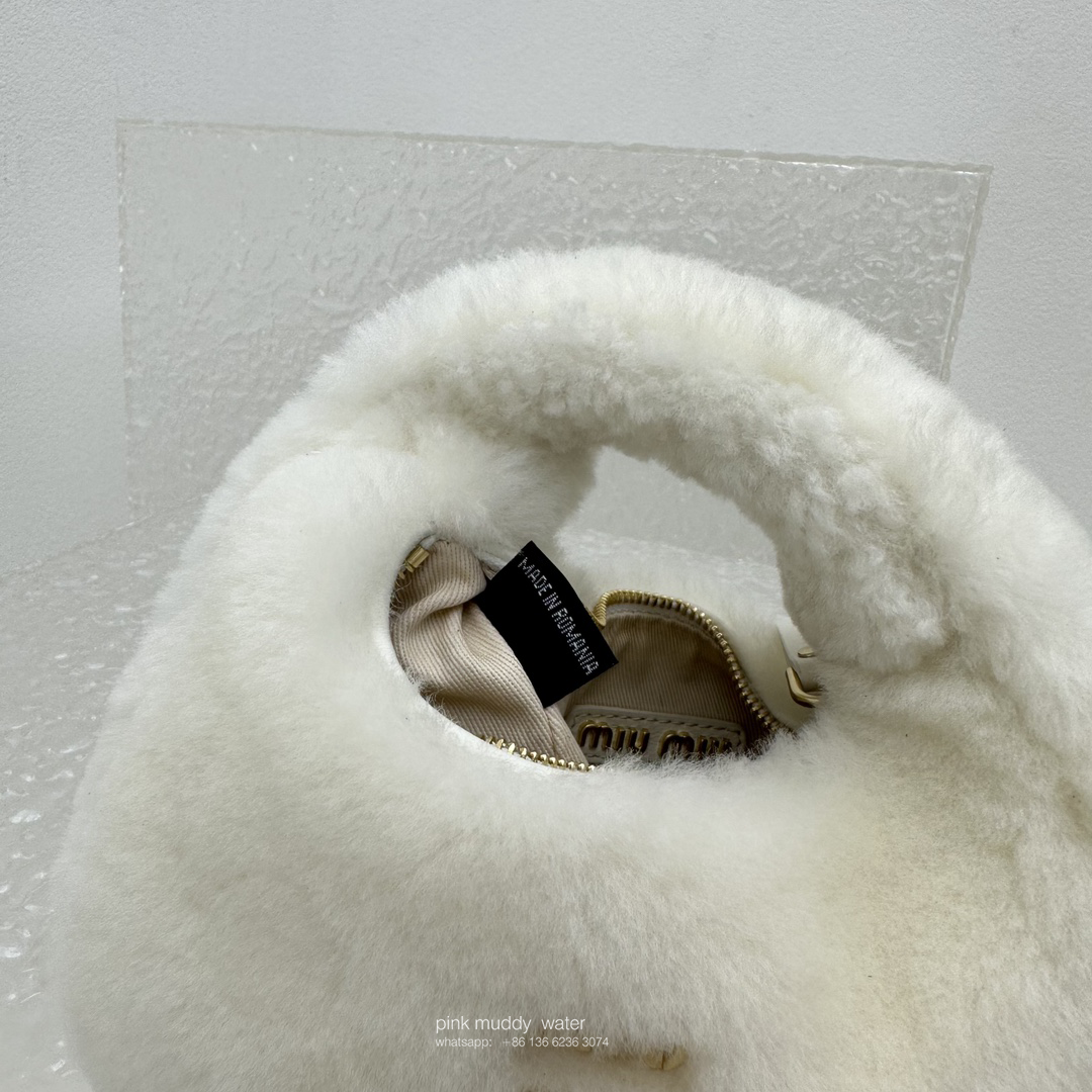 Wander leather detail shearling crescent bag